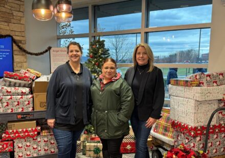 Discovery FCU employees present Opportunity House with Christmas gifts