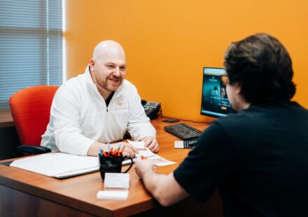 Josh talking to a member at Discovery Federal Credit Union.