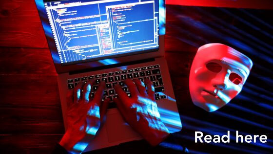 computer and hacker with mask