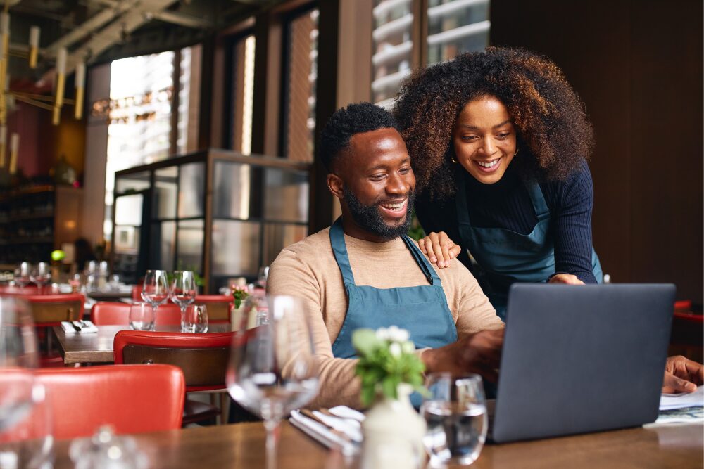 business owners at a computer