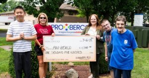 Discovery FCU presents check to ProBerco