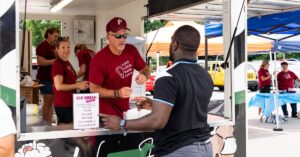 Discovery employee serves ice cream