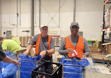 Discovery FCU board members volunteer at Helping Harvest