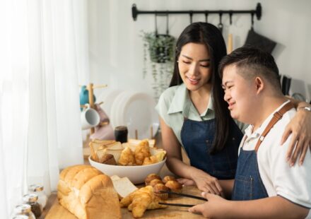 Adult with disability baking with family